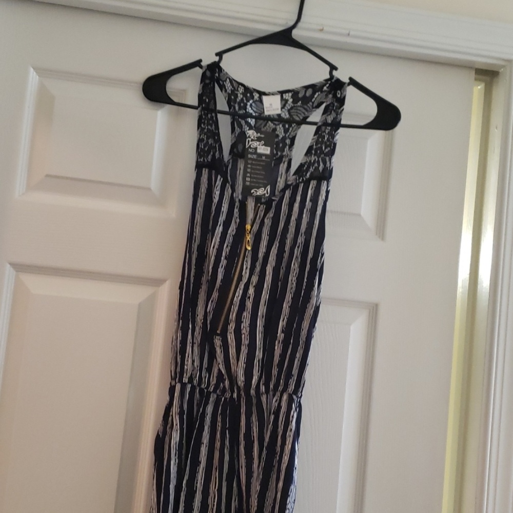 Navy blue/white romper. Back detailing is black